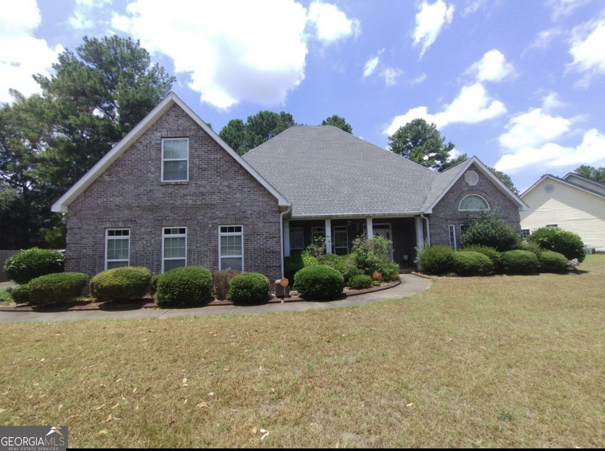 a front view of a house with a yard