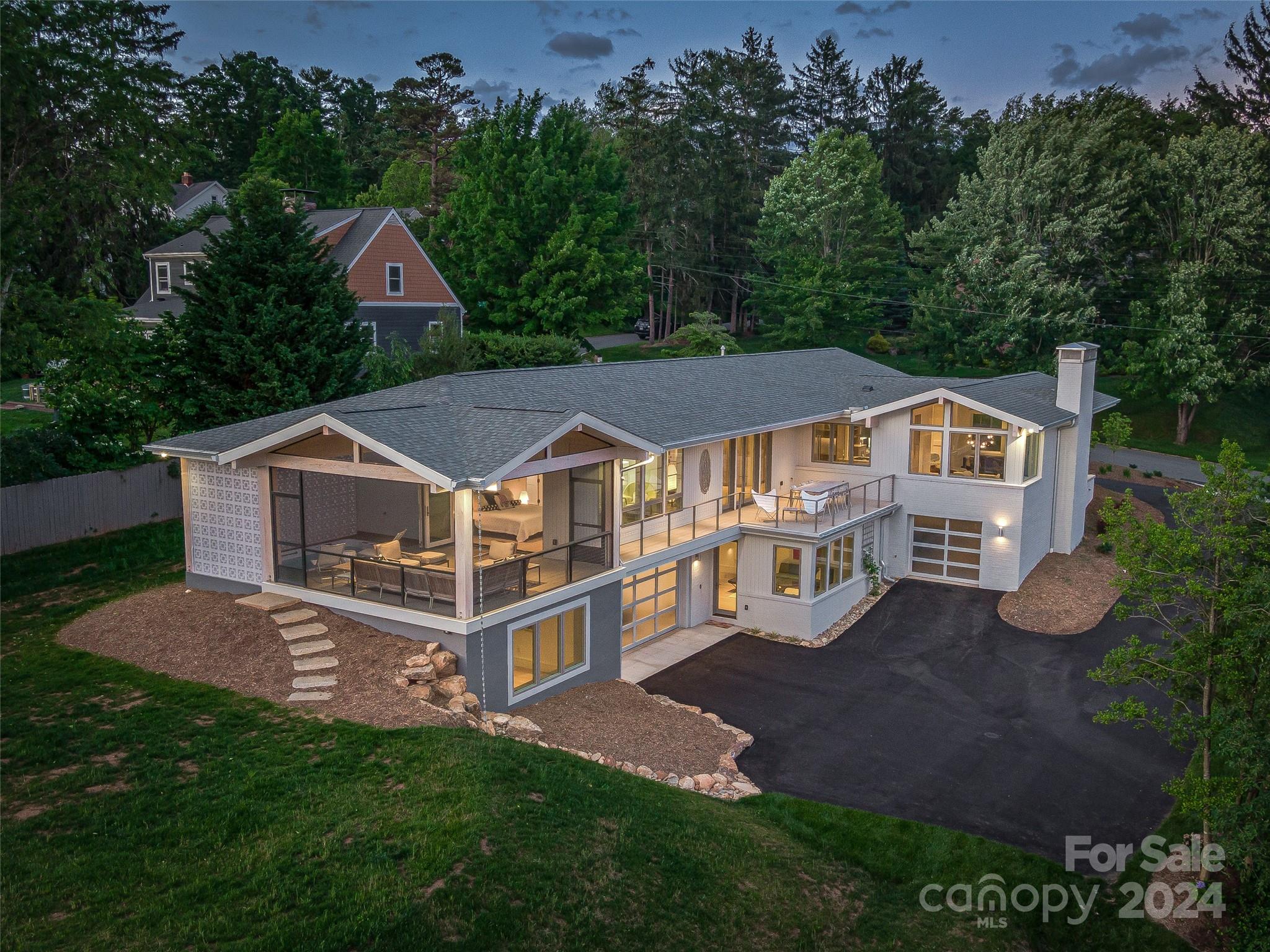 an aerial view of a house with a big yard