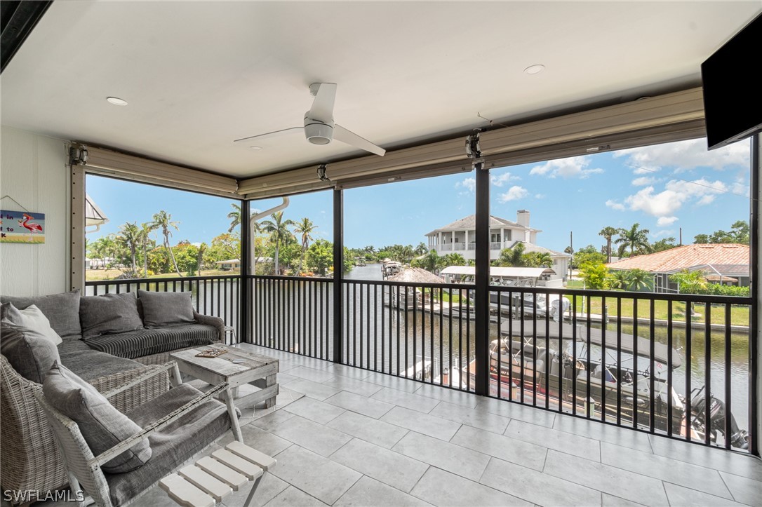 a balcony with furniture and wooden floor