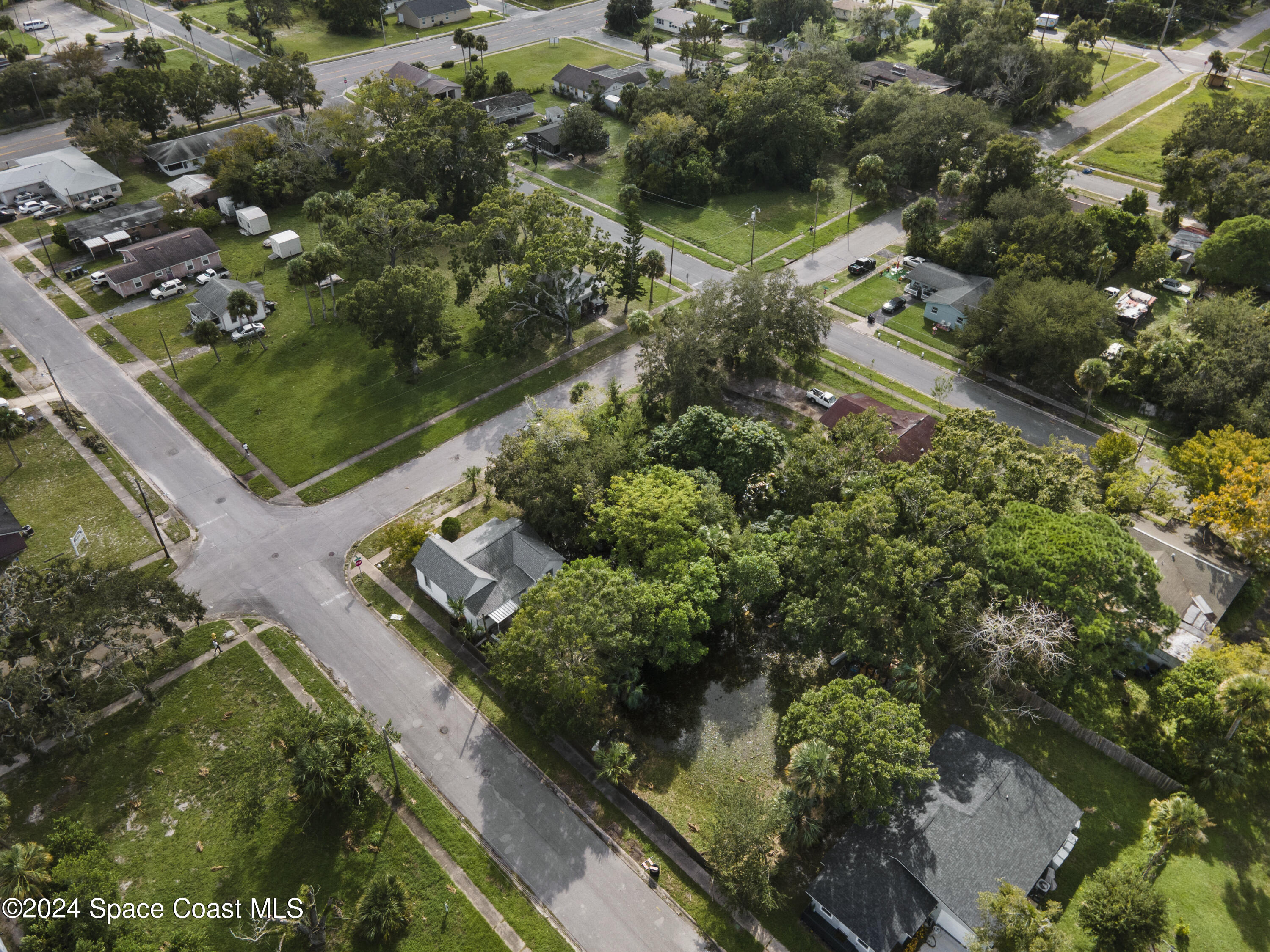 an aerial view of a residential houses with outdoor space