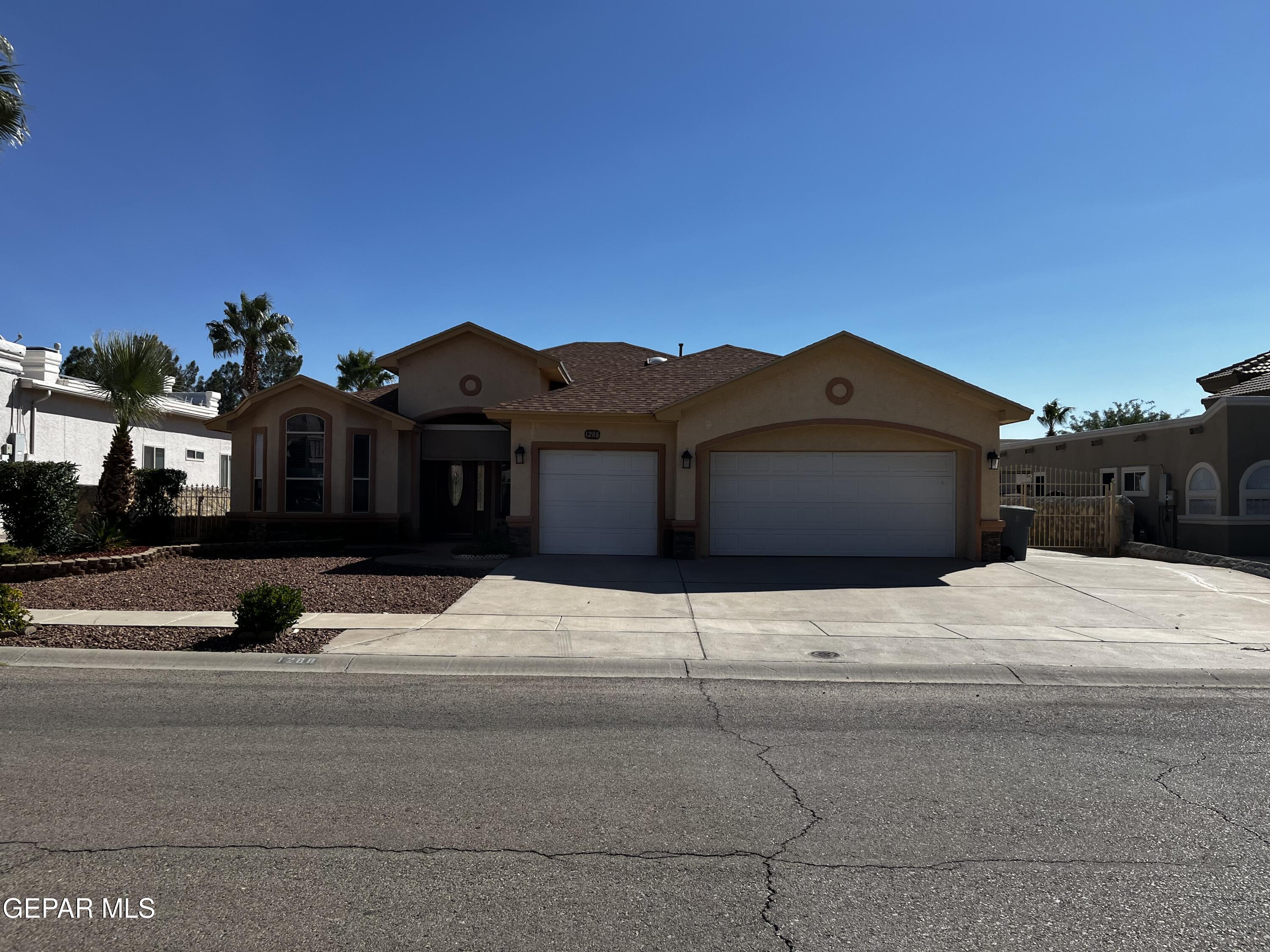 a view of a house with a street