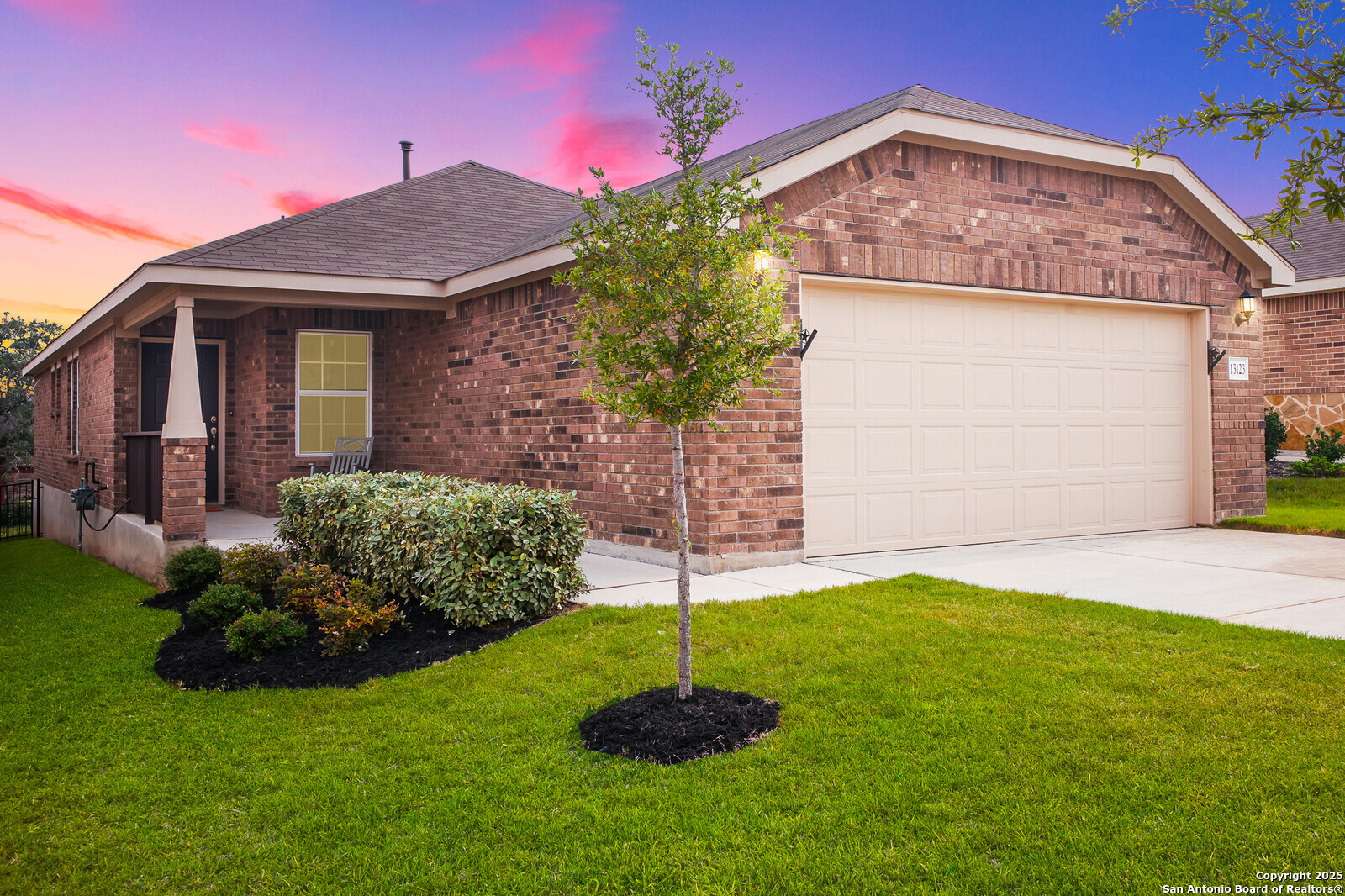 a front view of a house with a yard