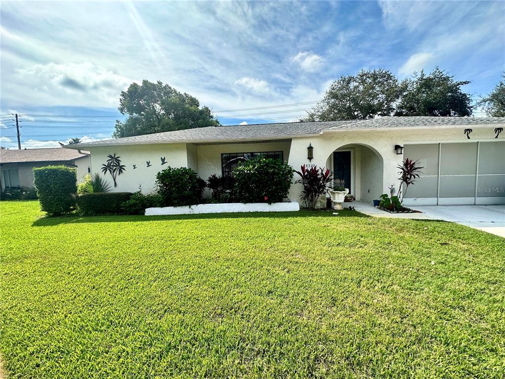 front view of a house with a yard