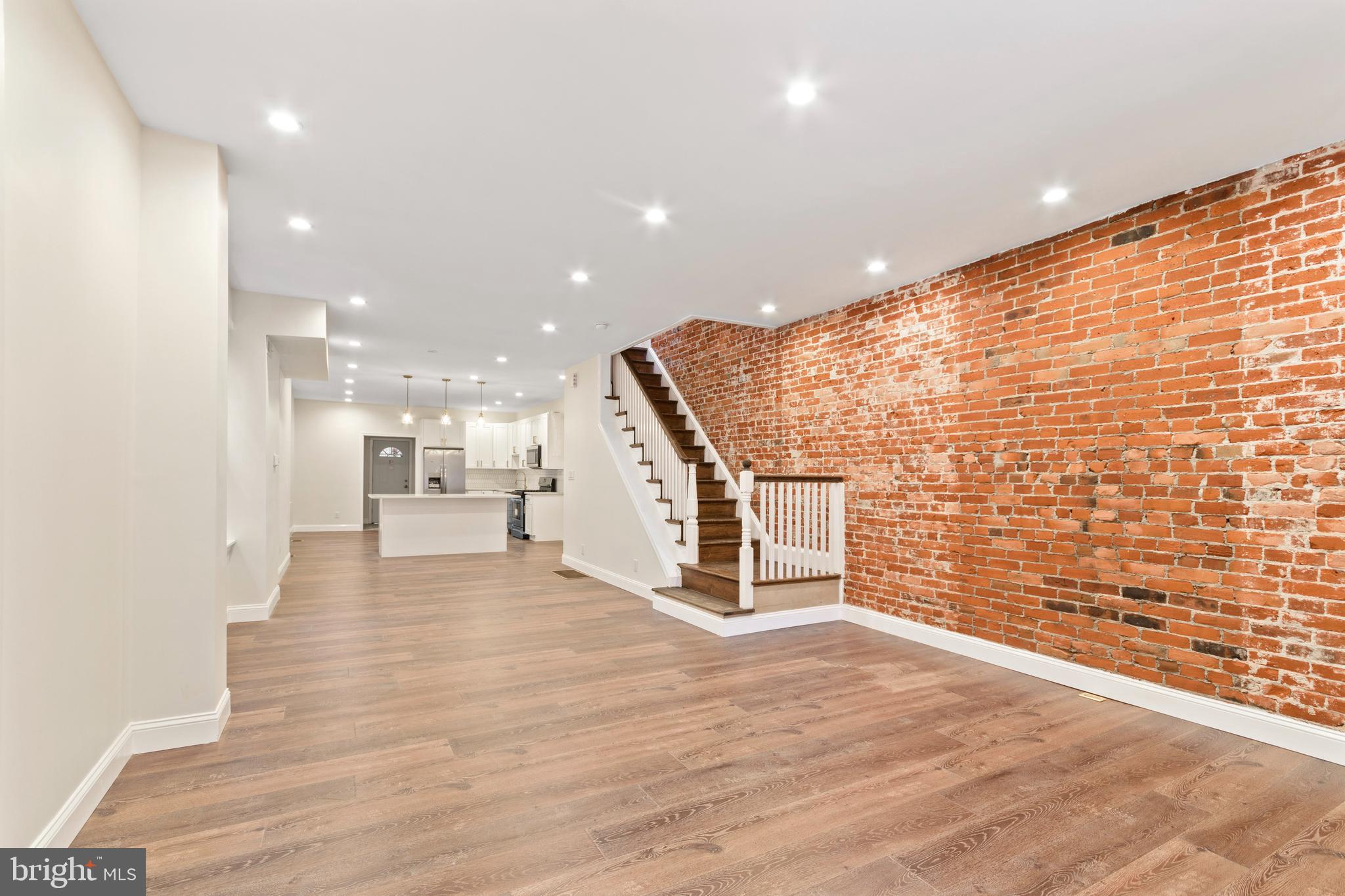 a view of a living room with a wooden floor