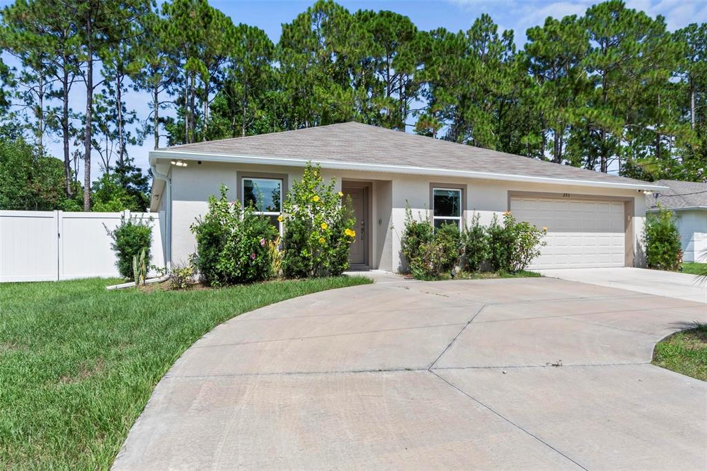 front view of a house with a yard