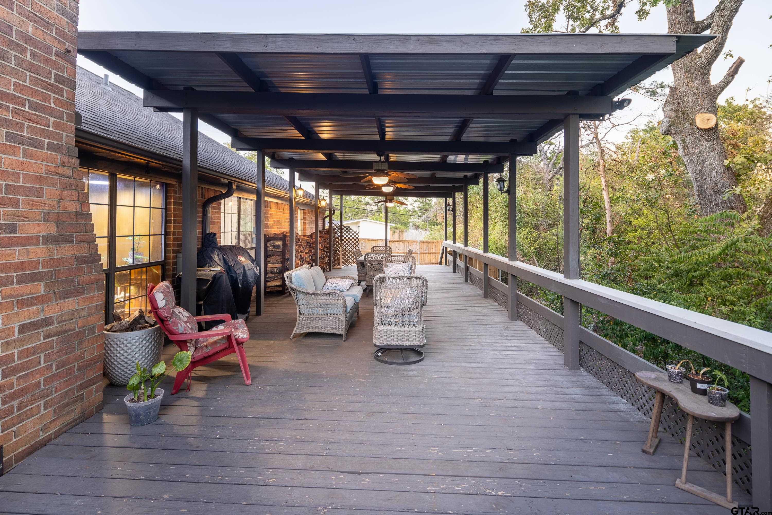 a view of a patio with table and chairs