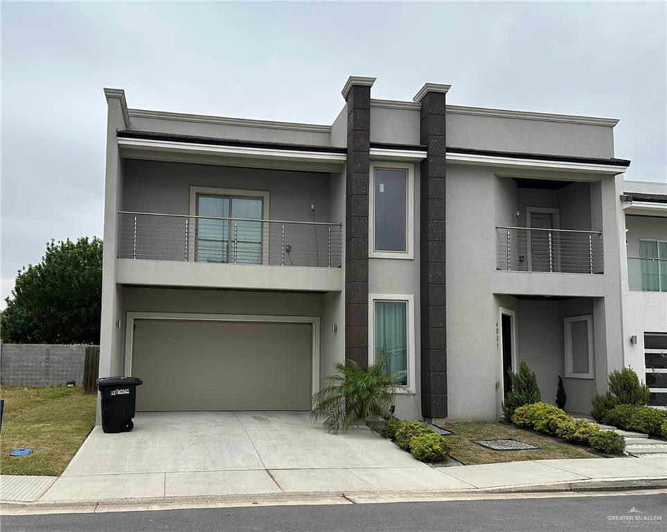 a front view of a house with garage