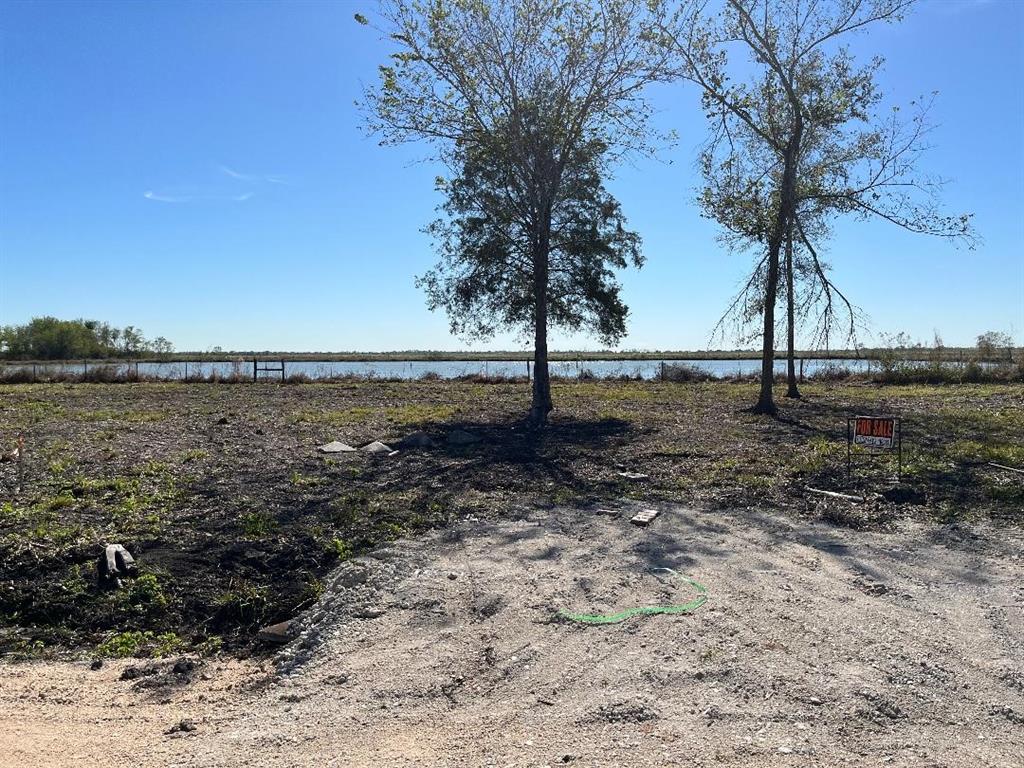 a view of a lake with a yard