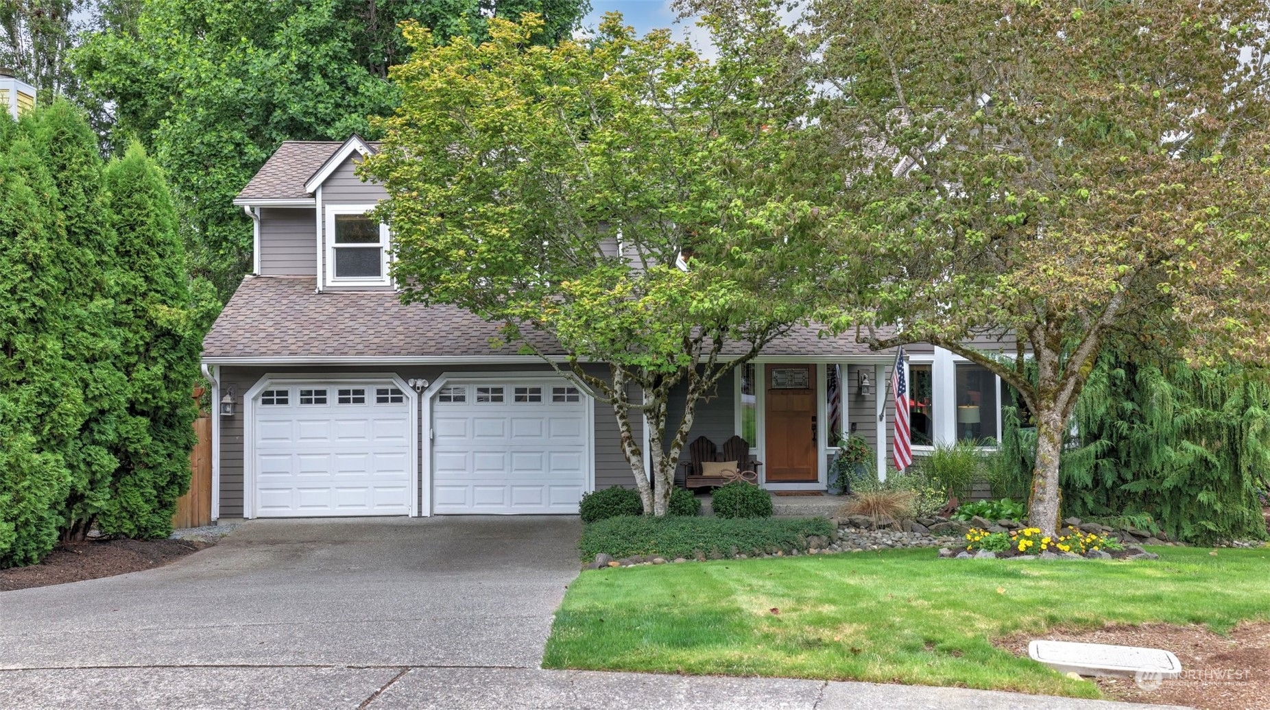 front view of a house with a yard