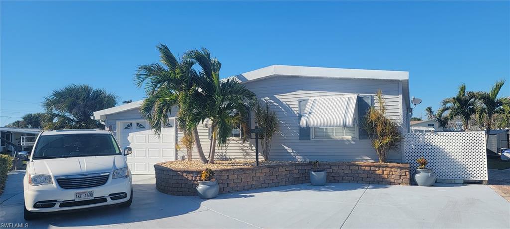 a front view of a house with sitting area