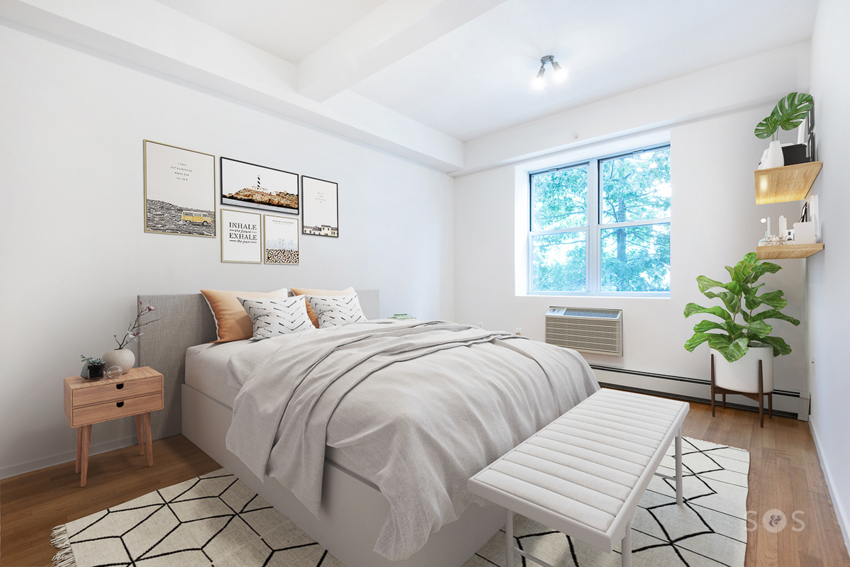 a bedroom with a bed and a window