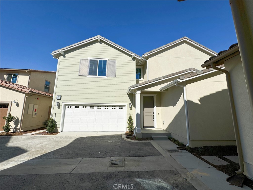 a view of a house with a garage