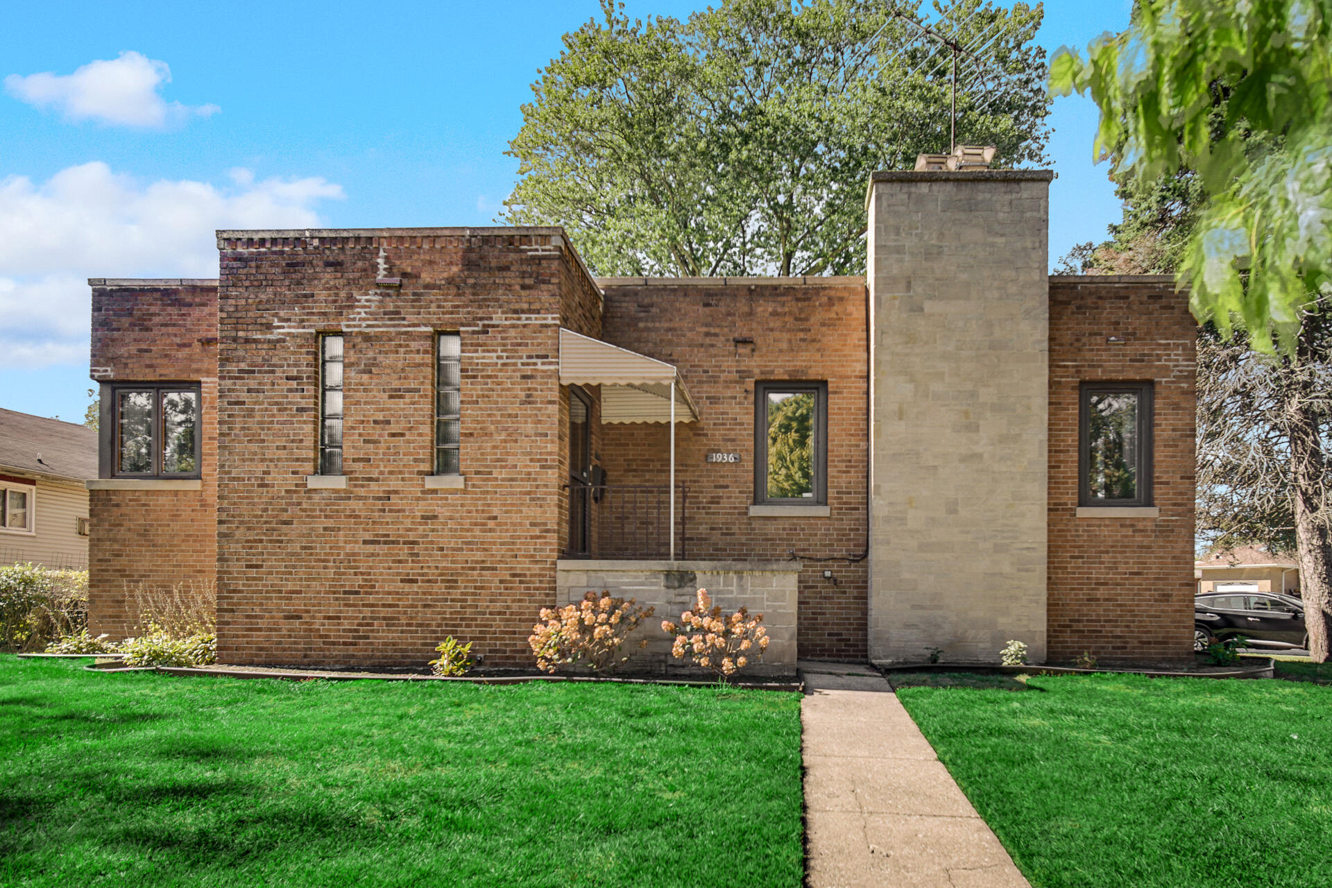 a brick building with a yard