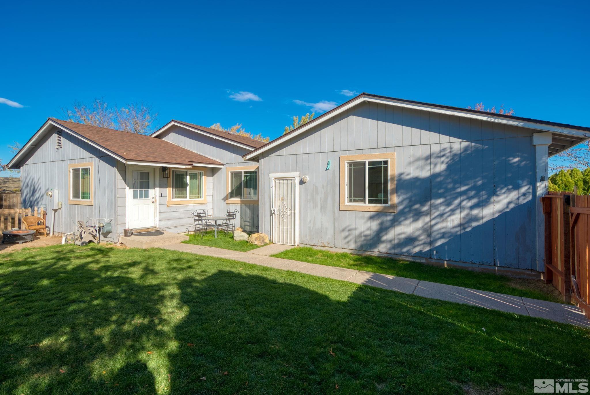 a front view of a house with a yard and porch