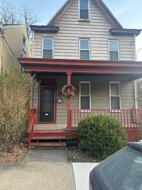 a front view of a house with porch