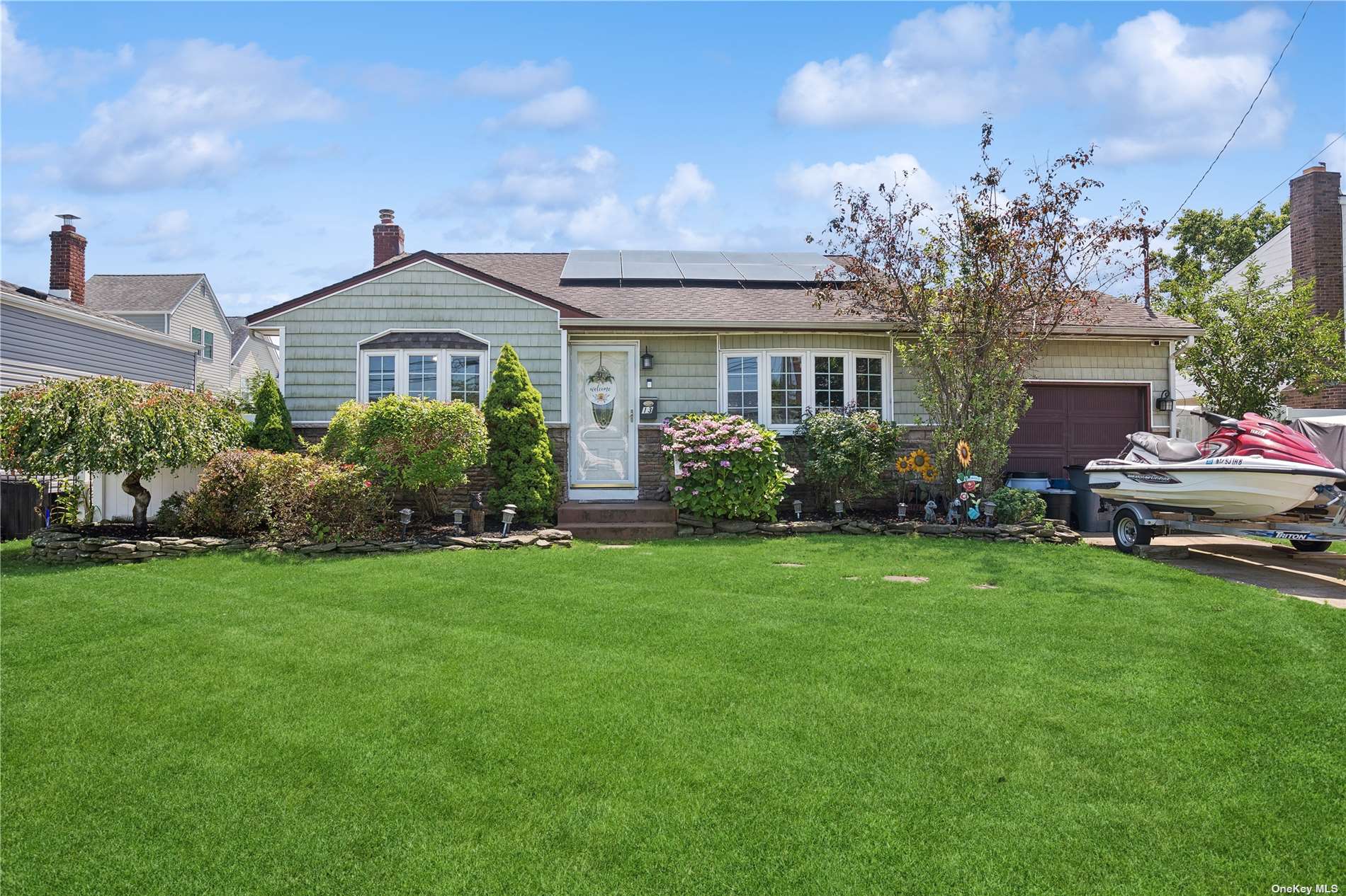 a front view of a house with garden