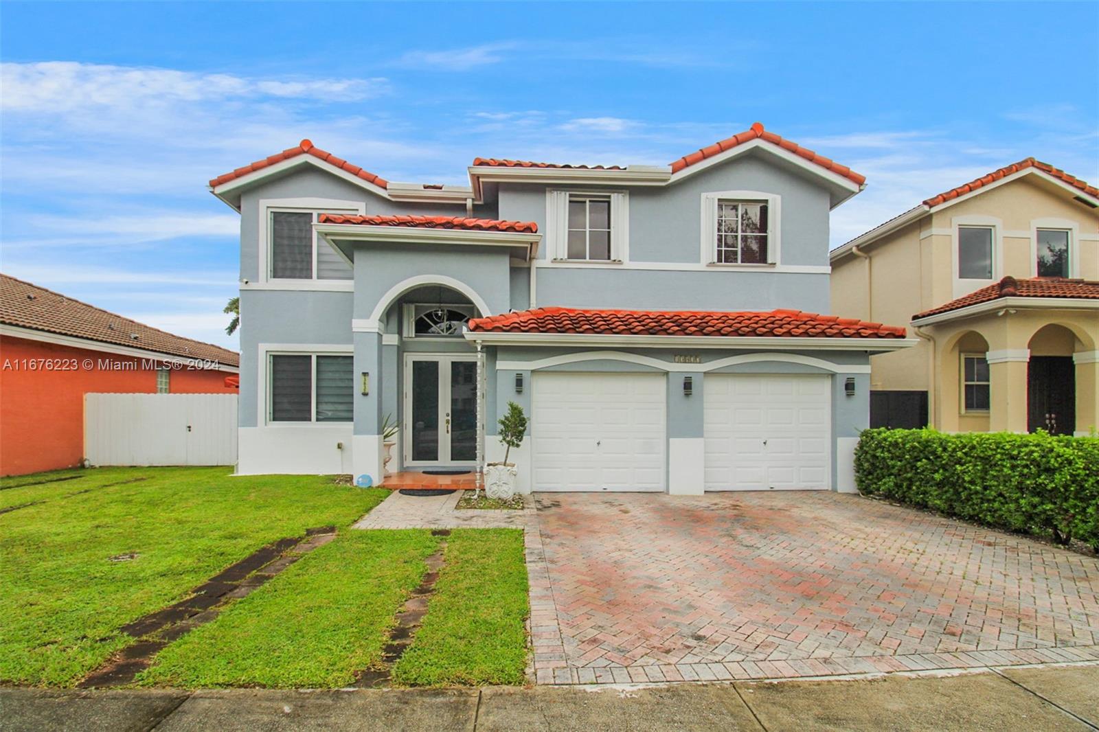 a front view of a house with a yard