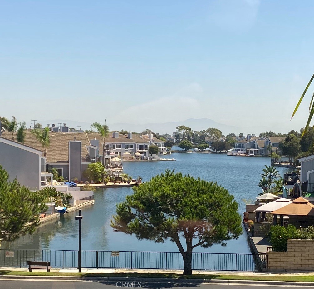 a view of lake and houses with outdoor space