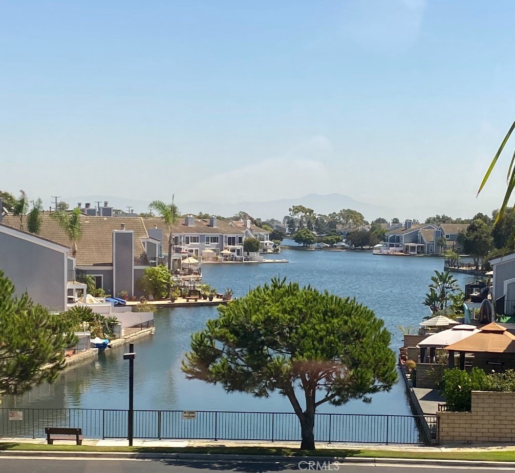 a view of lake and houses with outdoor space