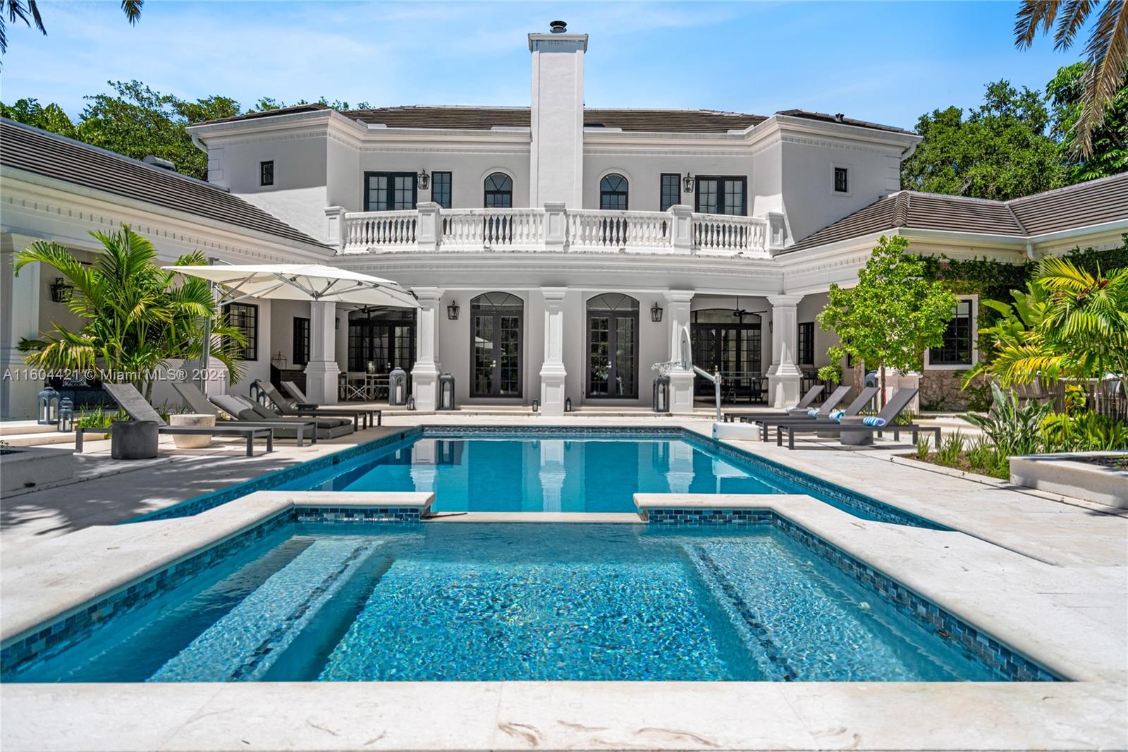 swimming pool view with outdoor seating