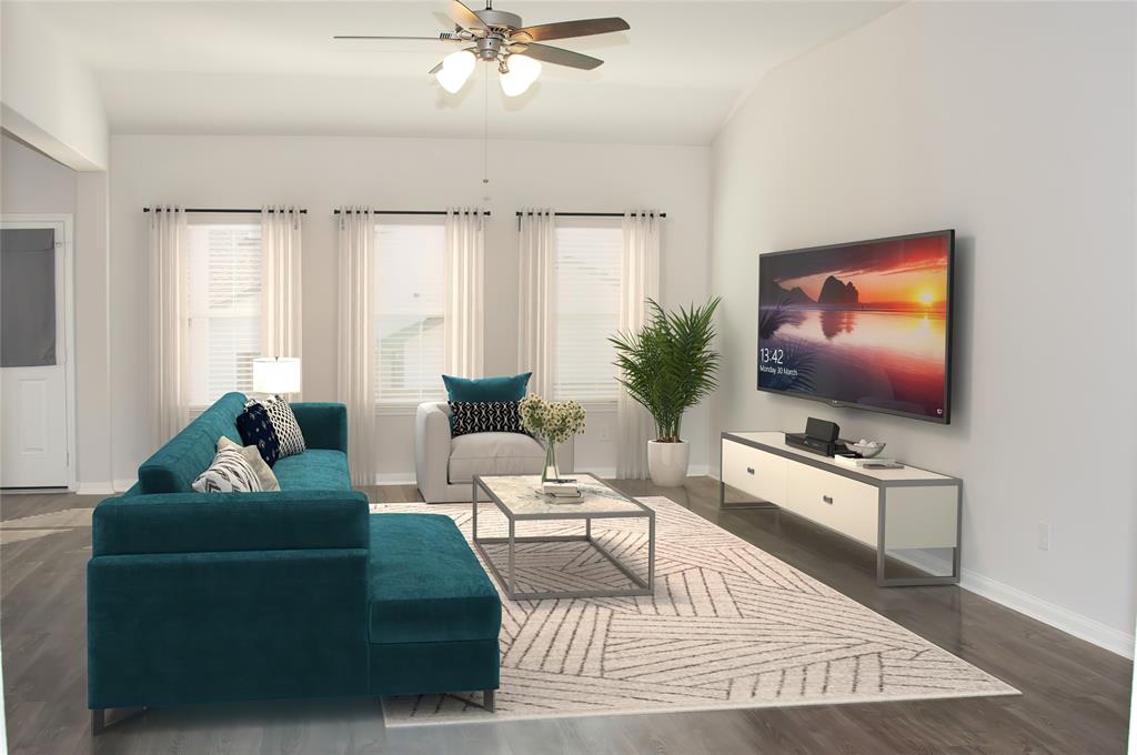 a living room with furniture and a flat screen tv