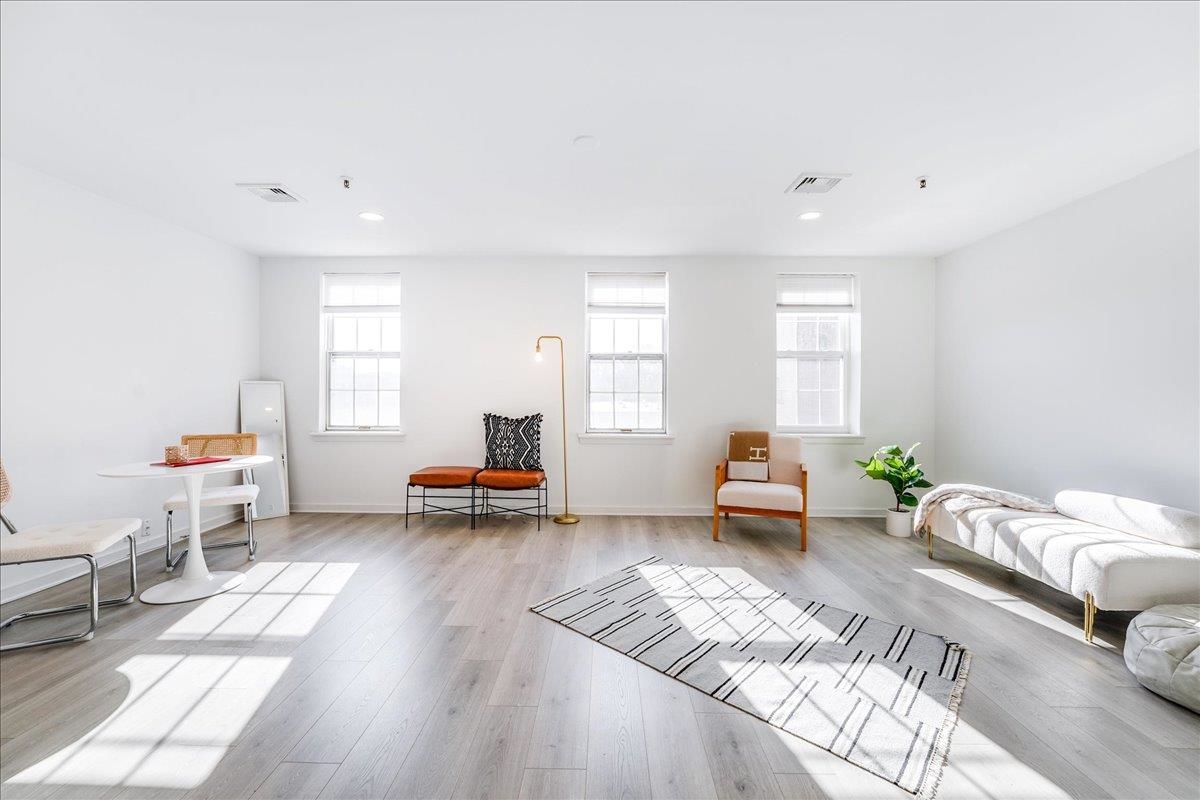 a bedroom with furniture and a window