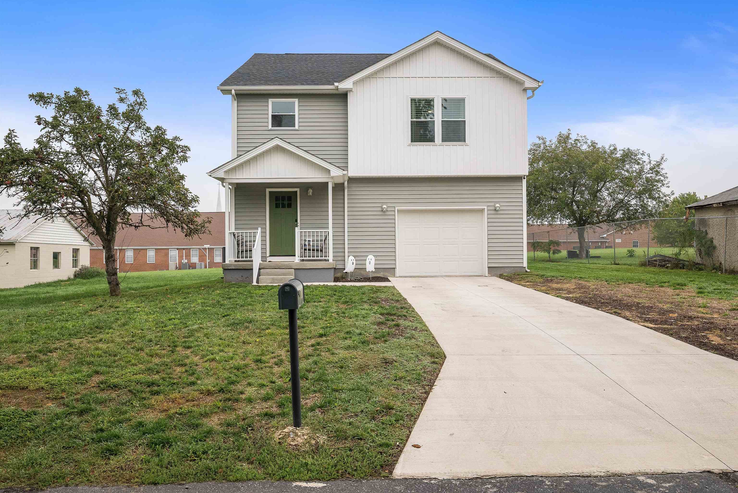 a front view of a house with a yard