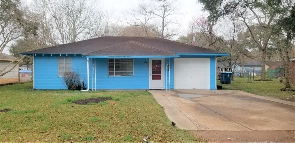 a house with yard in front of it