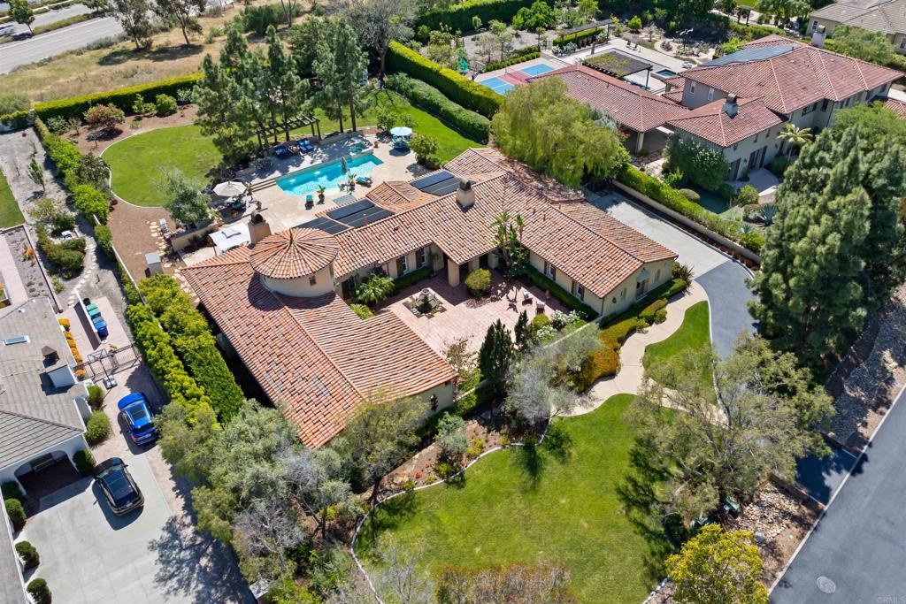 an aerial view of a house with a garden