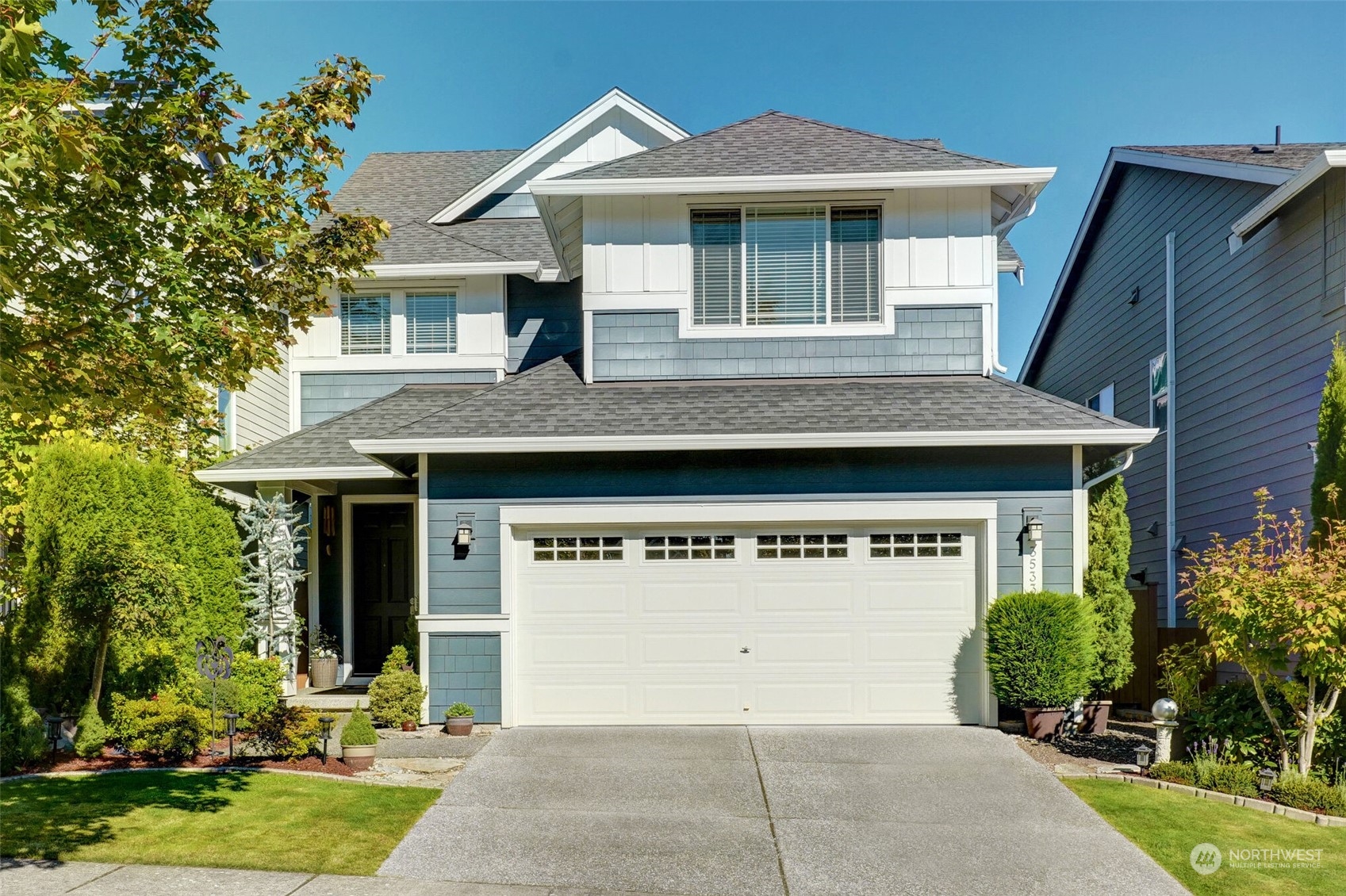 a front view of a house with garden