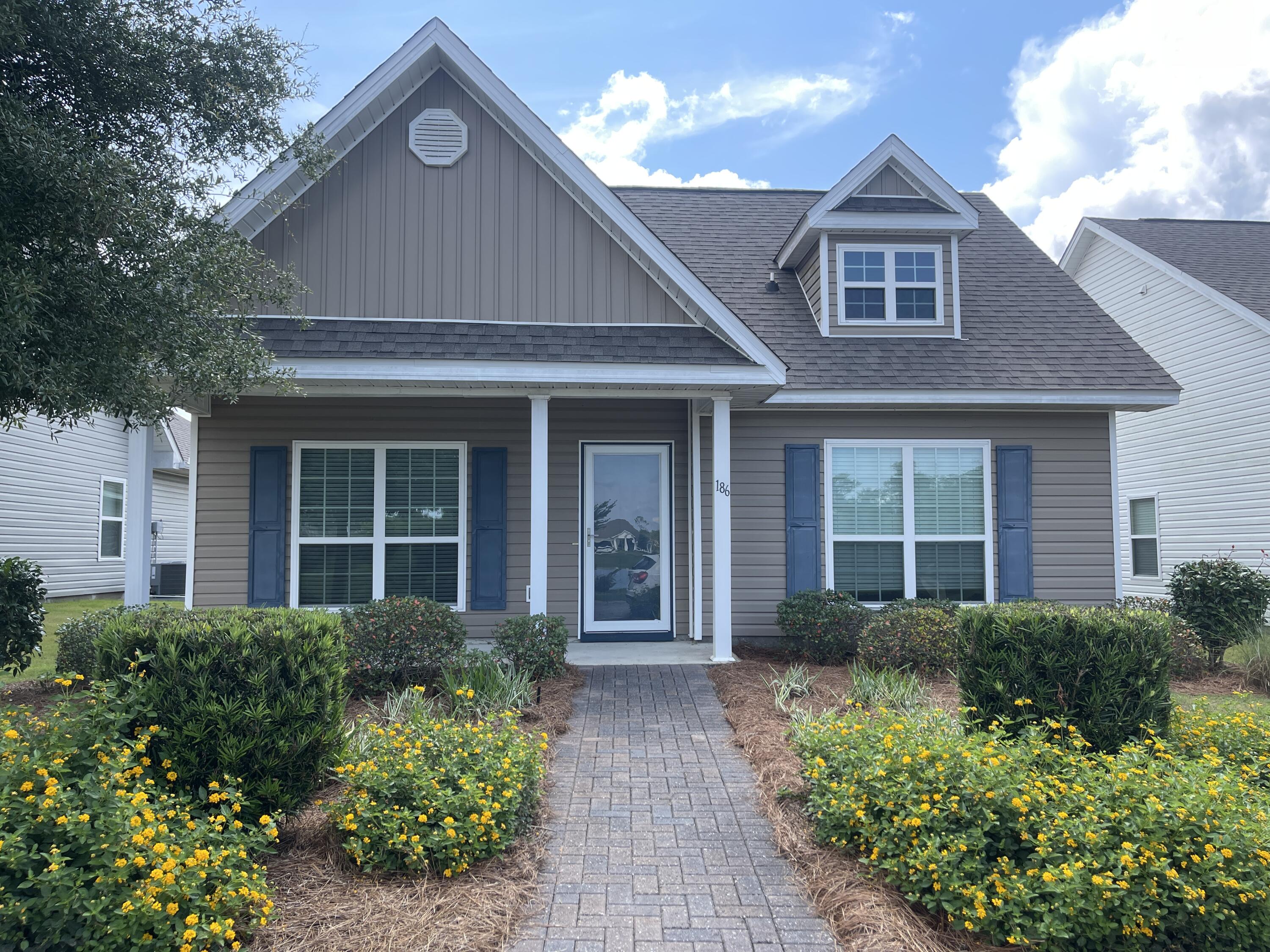 front view of a house with a yard