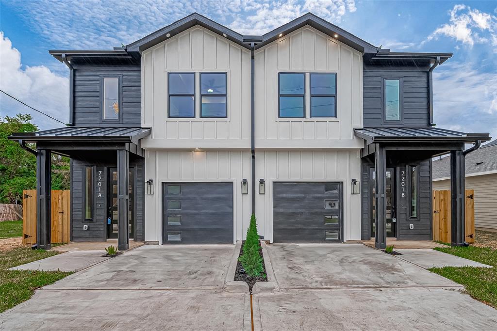 a front view of a house with garage