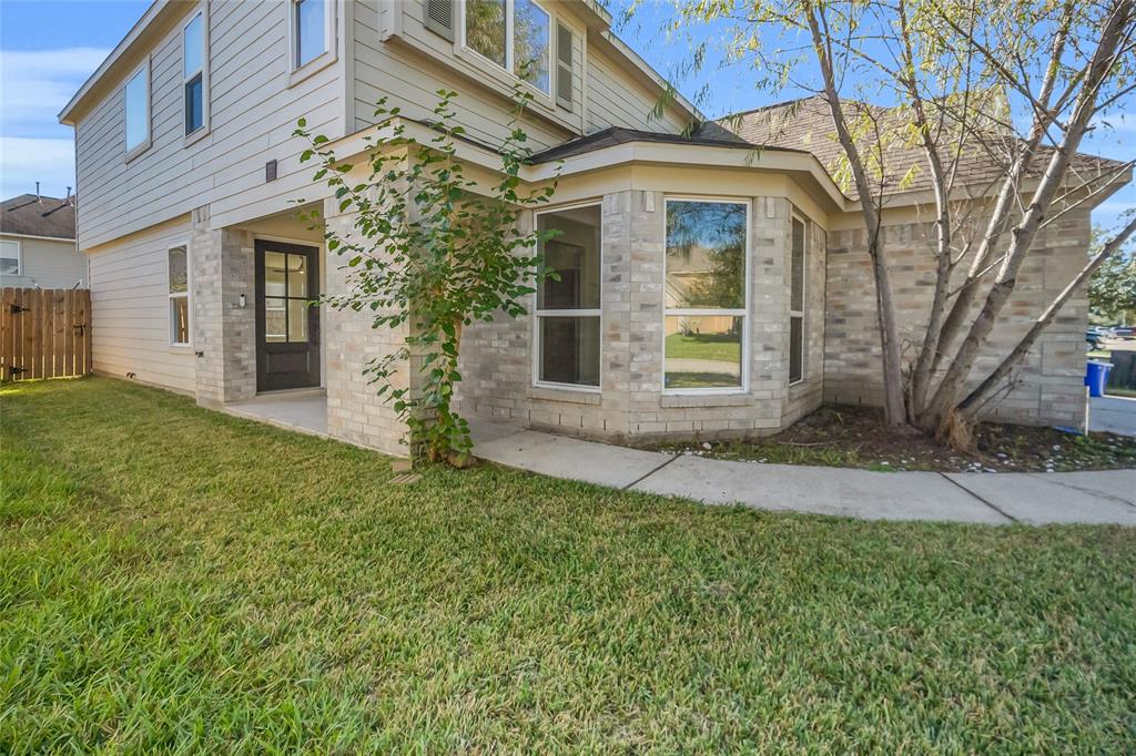 front view of a house with a yard