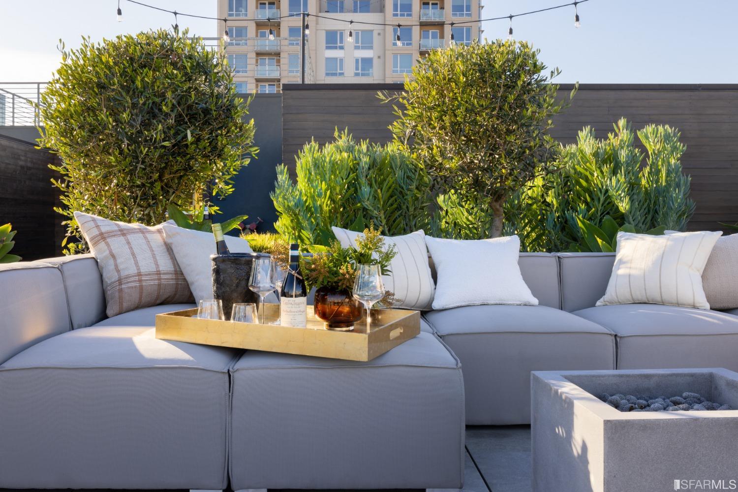 a outdoor living space with furniture and flowers