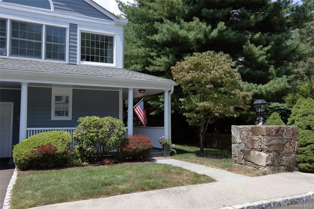 a view of a house with a yard and plants