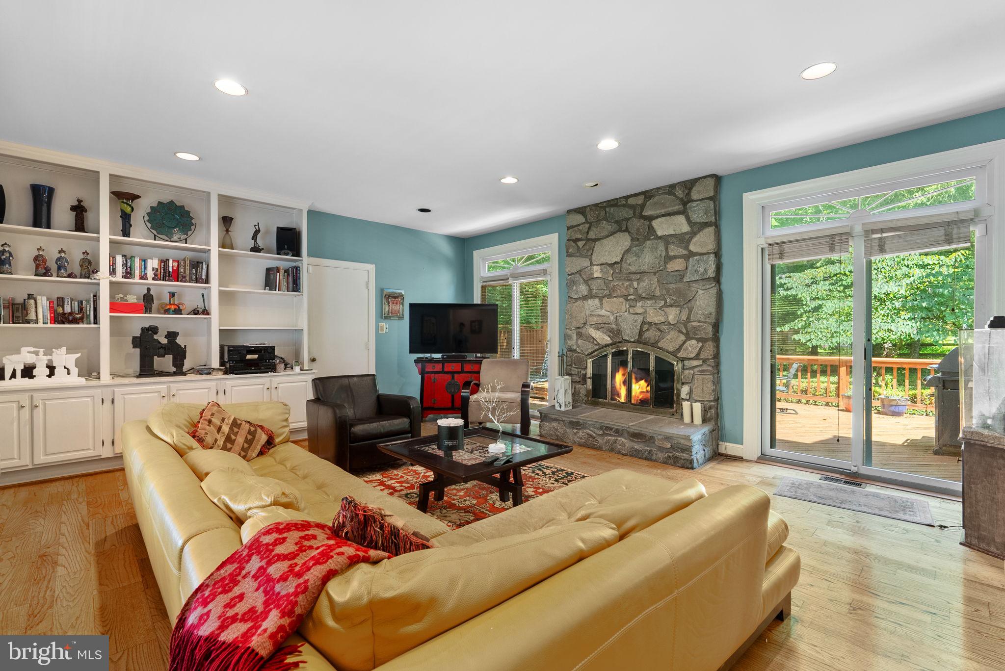 a living room with furniture fireplace and flat screen tv