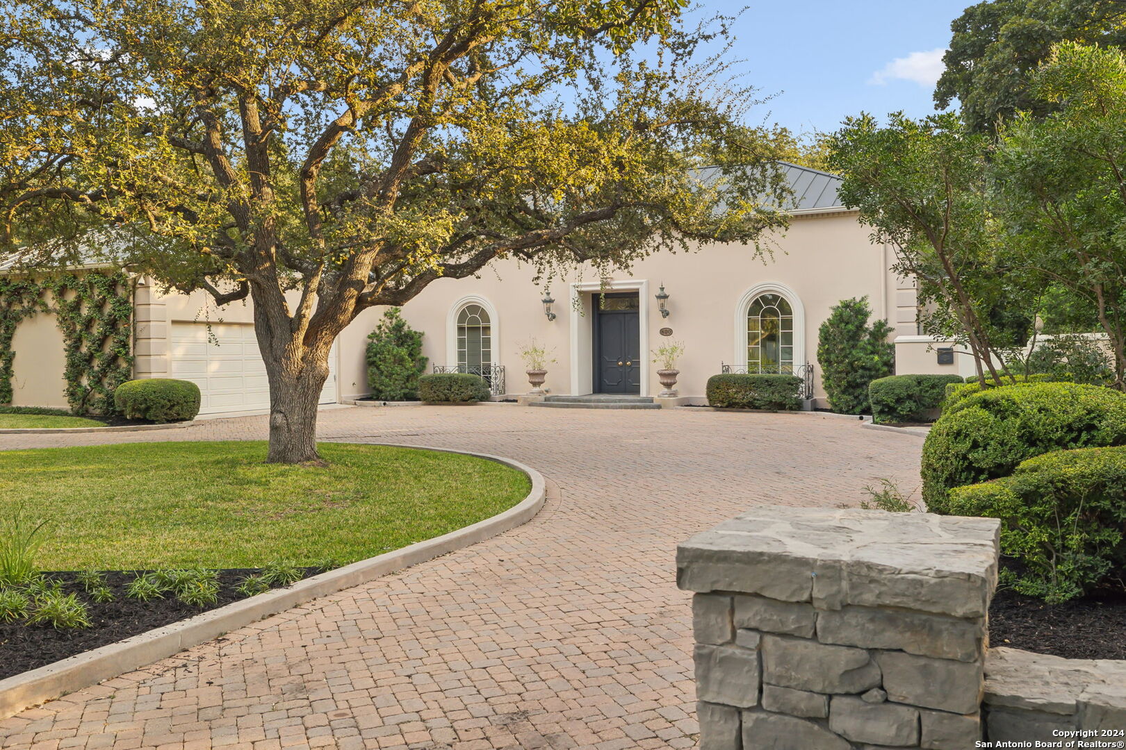 a front view of a house with garden