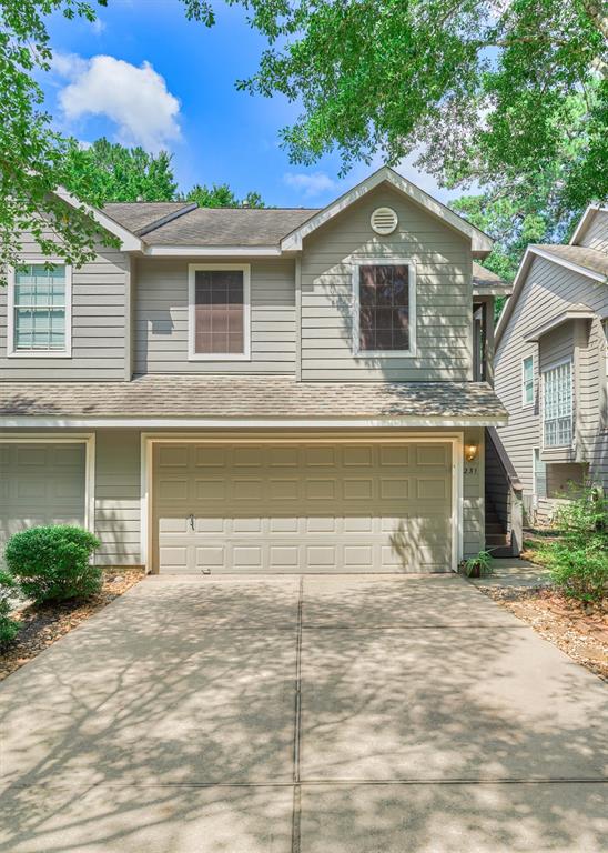 a front view of a house with garage