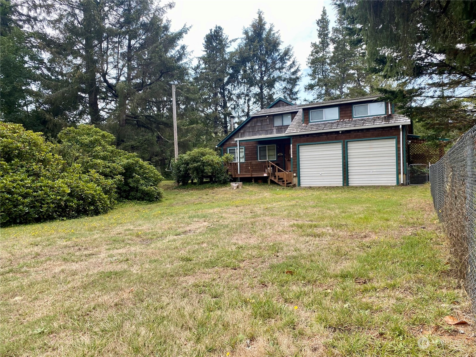 a front view of a house with yard