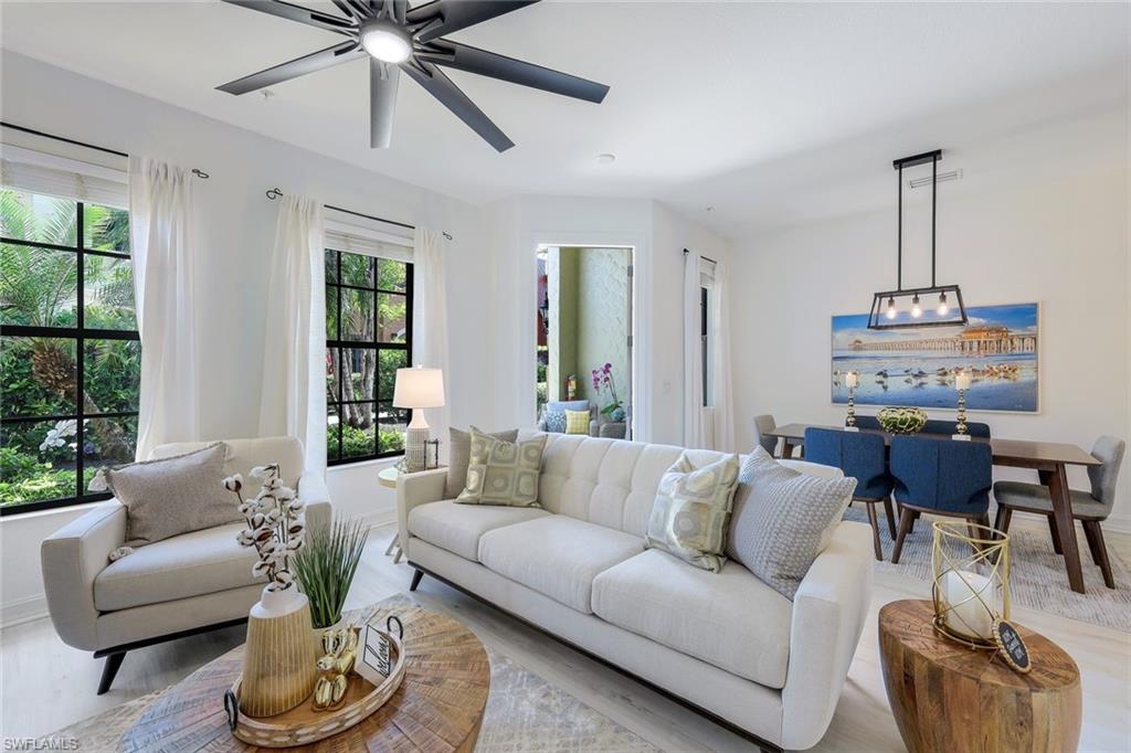 a living room with furniture and a window