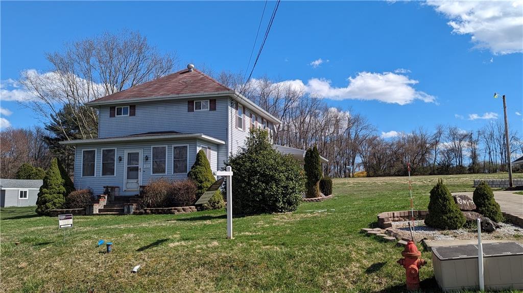 a view of a house with a garden