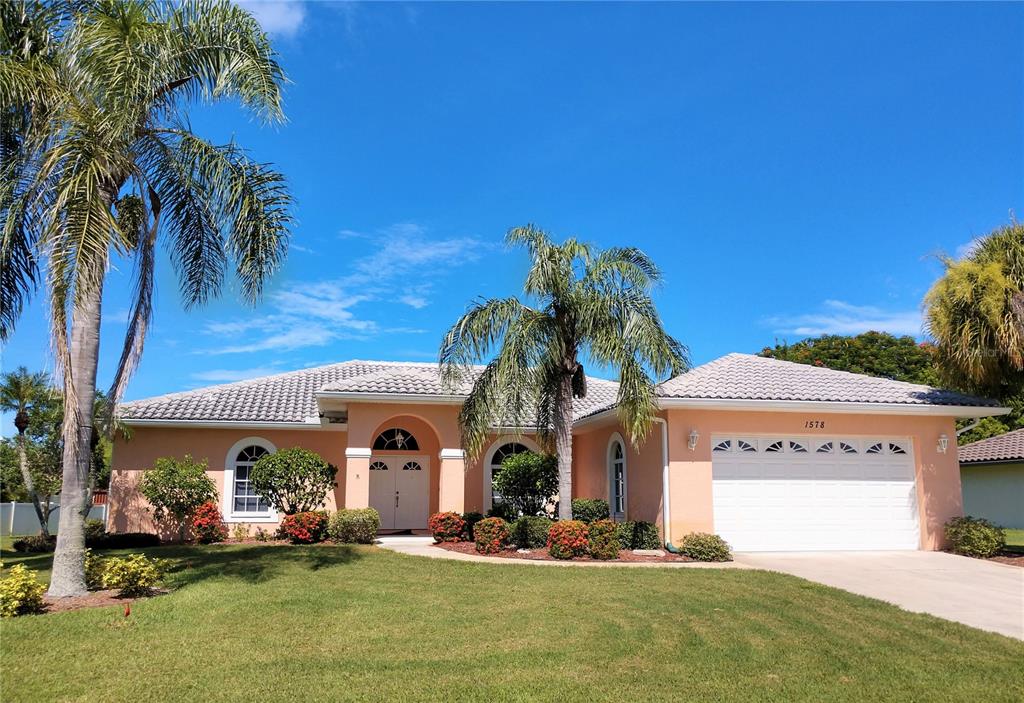 a front view of a house with a yard