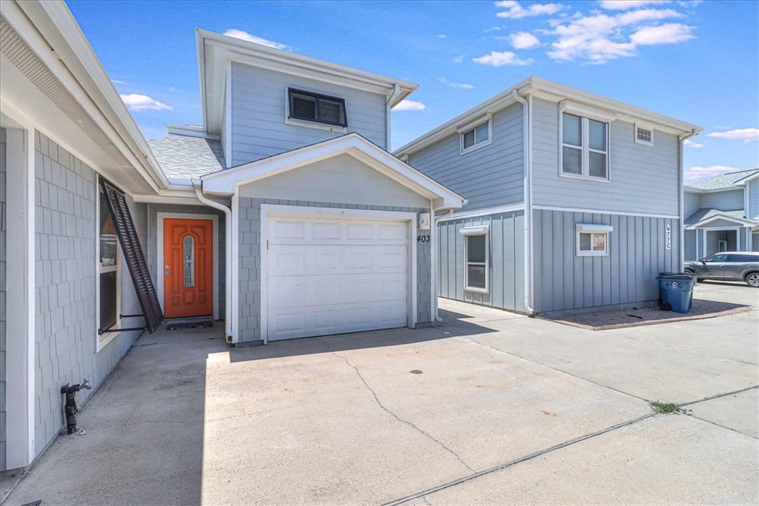 a front view of a house with garage