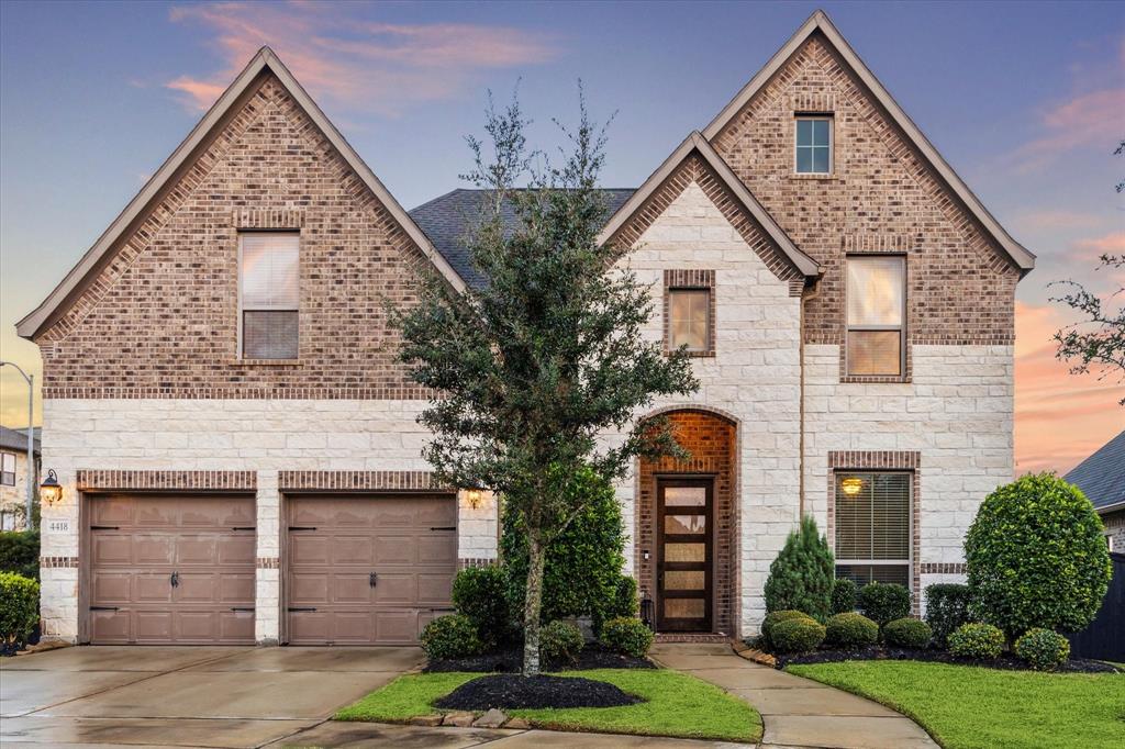 Welcome Home to 4418 Million Bells Way in Harvest Green, Richmond Tx.  This beautiful home sits on a private cul-de-sac with an elegant brick and stone elevation.