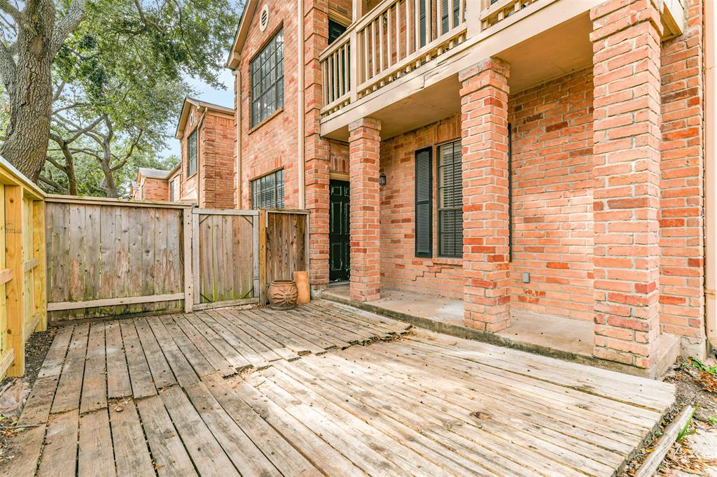 a view of a brick house with many windows