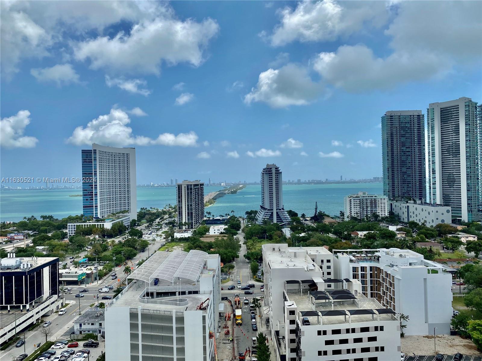 a view of a city with tall buildings