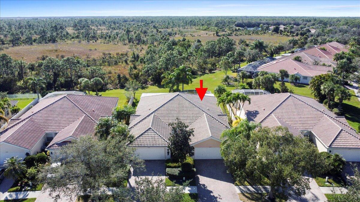 an aerial view of house with yard