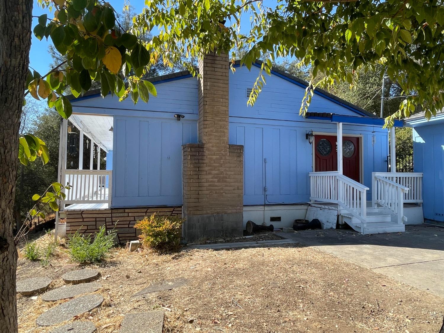 a front view of a house with garden