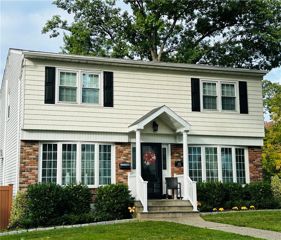 View of front of home featuring a front lawn