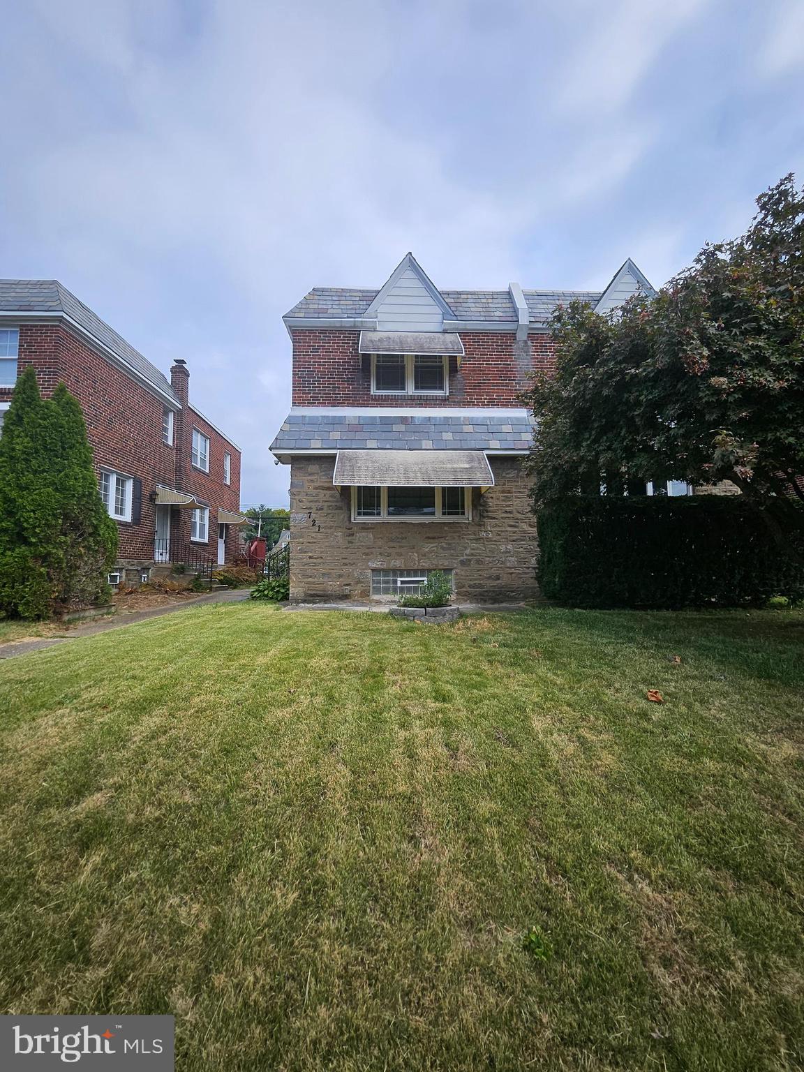 front view of a house with a yard